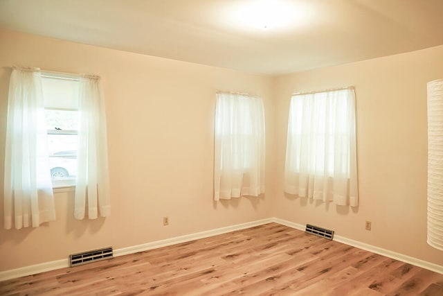 spare room featuring light hardwood / wood-style flooring