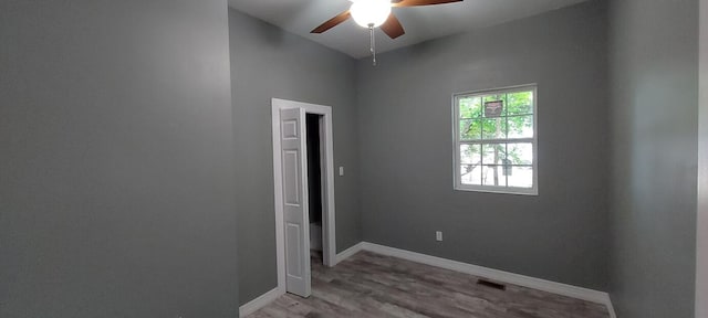 spare room featuring light hardwood / wood-style floors and ceiling fan