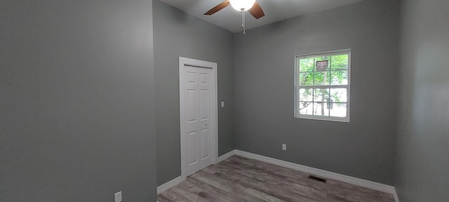 unfurnished room featuring wood-type flooring and ceiling fan