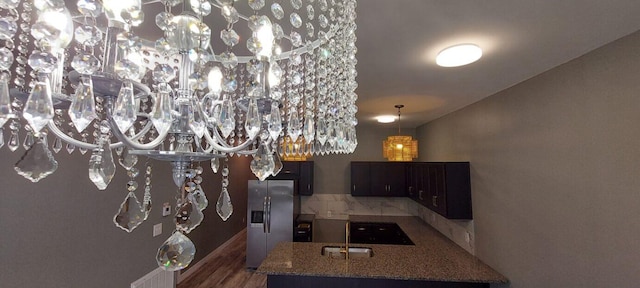 interior space with dark hardwood / wood-style flooring and sink