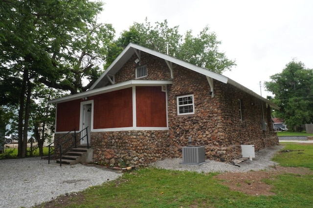 view of property exterior with central AC