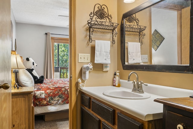 bathroom featuring vanity and a textured ceiling