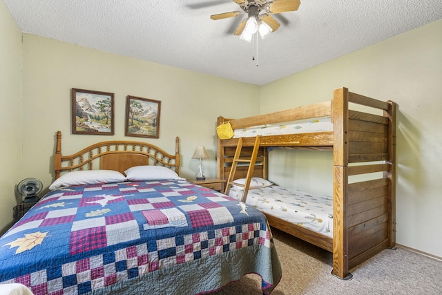 carpeted bedroom featuring a textured ceiling and ceiling fan