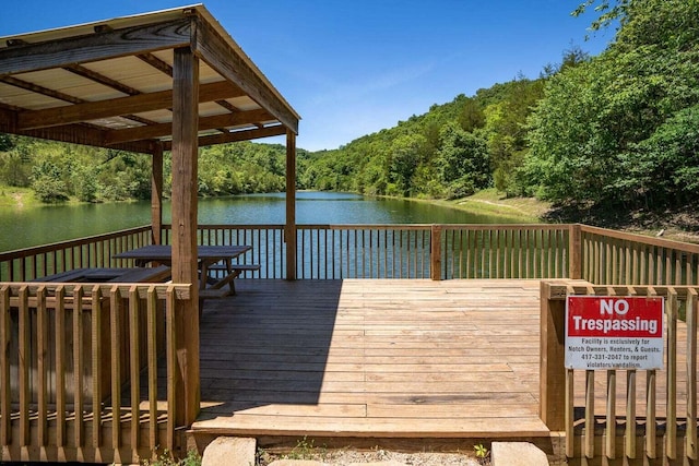 view of dock featuring a deck with water view