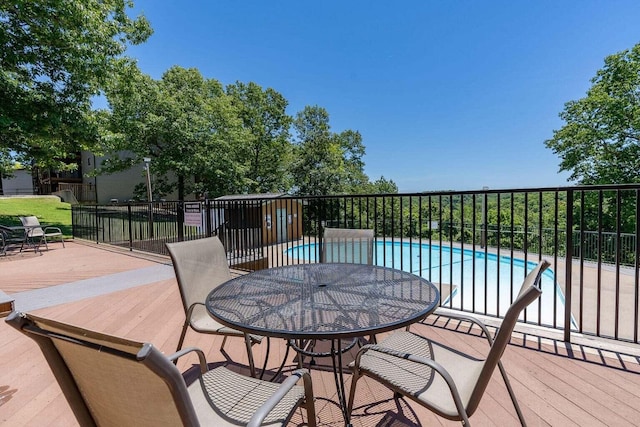 wooden terrace featuring a community pool