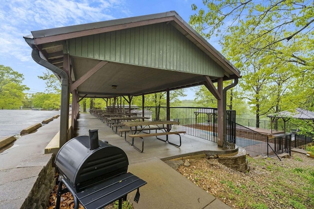 surrounding community with a gazebo and a patio area