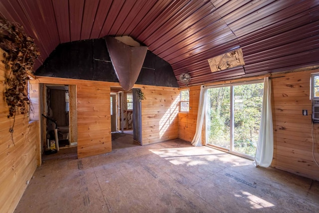 unfurnished room with lofted ceiling, wooden ceiling, and wooden walls