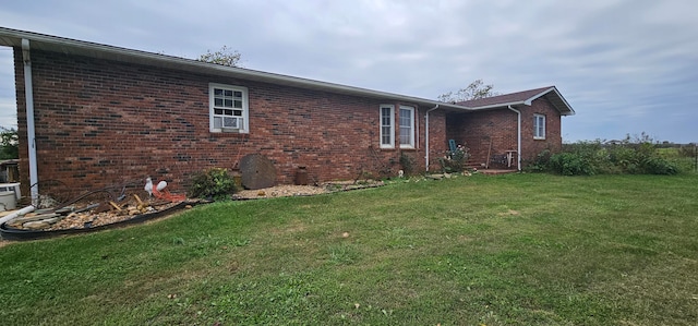 view of side of home featuring a yard