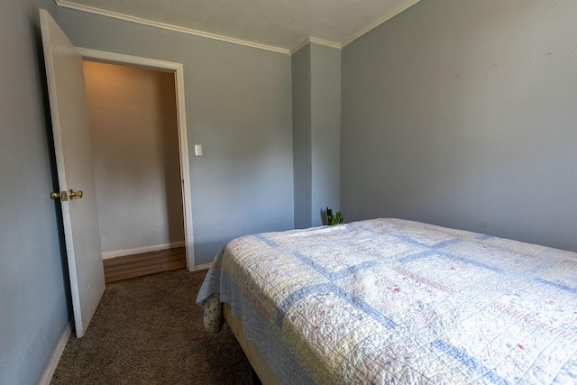 carpeted bedroom with ornamental molding