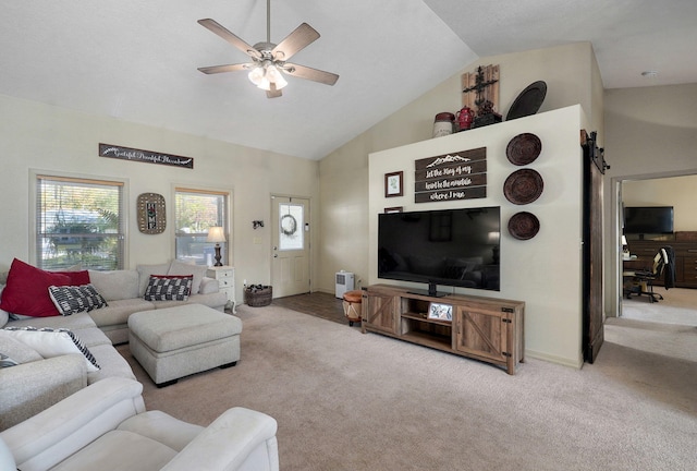 carpeted living room featuring high vaulted ceiling and ceiling fan