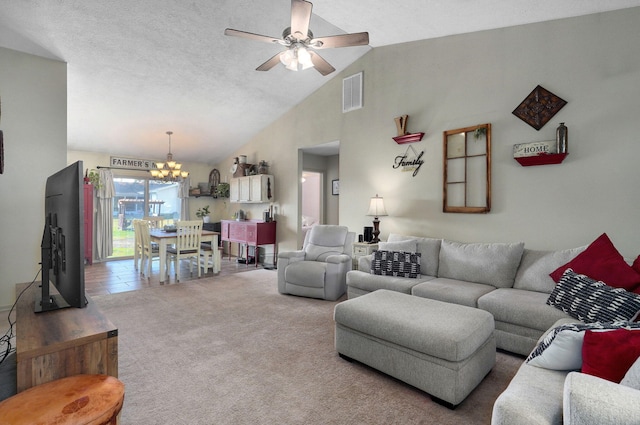 living room featuring ceiling fan with notable chandelier, high vaulted ceiling, a textured ceiling, and carpet flooring