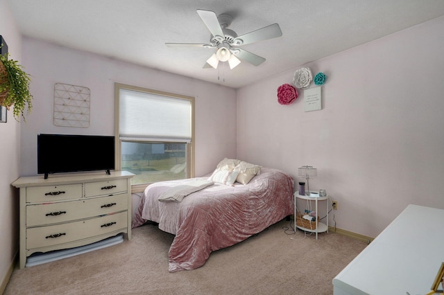 bedroom with light colored carpet and ceiling fan