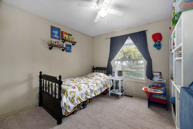 bedroom with ceiling fan and carpet flooring