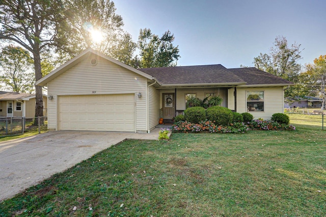 single story home with a garage and a front lawn