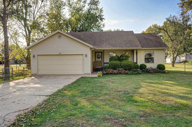 single story home with a garage and a front lawn