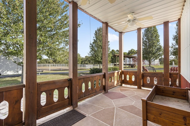 sunroom / solarium with ceiling fan