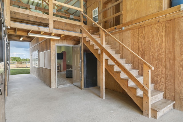 interior space featuring wooden walls