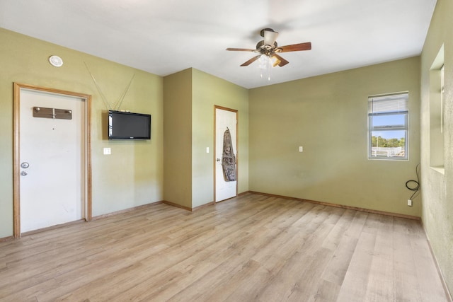 unfurnished room featuring ceiling fan and light hardwood / wood-style flooring