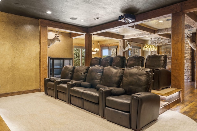 cinema with wood finished floors, baseboards, beam ceiling, visible vents, and recessed lighting
