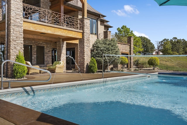pool featuring a patio area