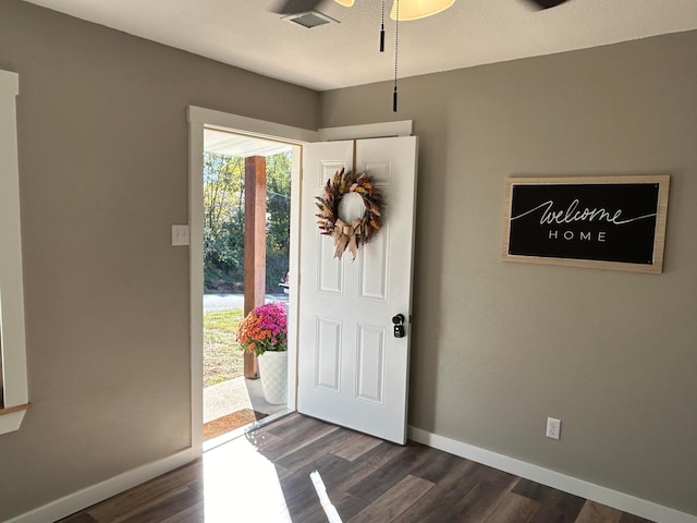 entryway with dark hardwood / wood-style floors