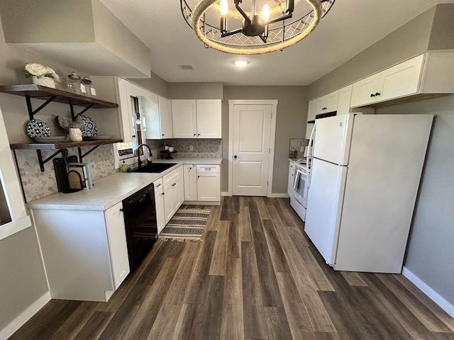 kitchen with white cabinetry, sink, dishwasher, and white fridge