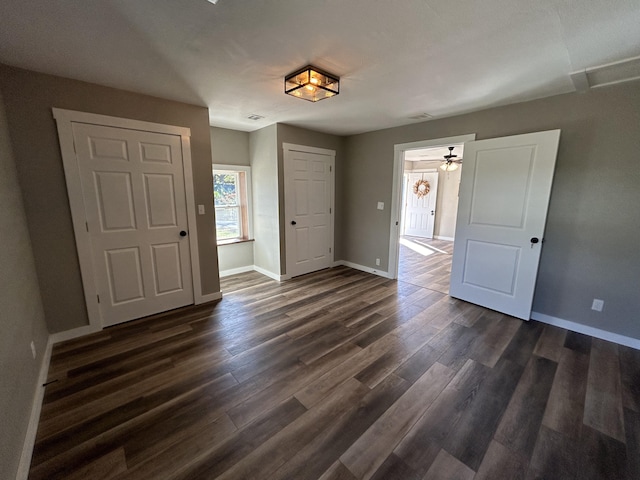 interior space with dark hardwood / wood-style floors