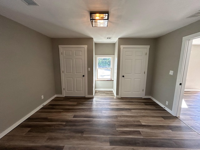 foyer entrance with dark hardwood / wood-style flooring