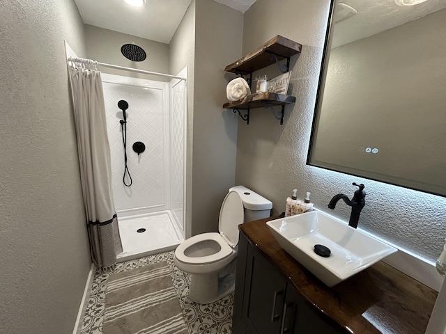 bathroom featuring toilet, vanity, tile patterned flooring, and curtained shower