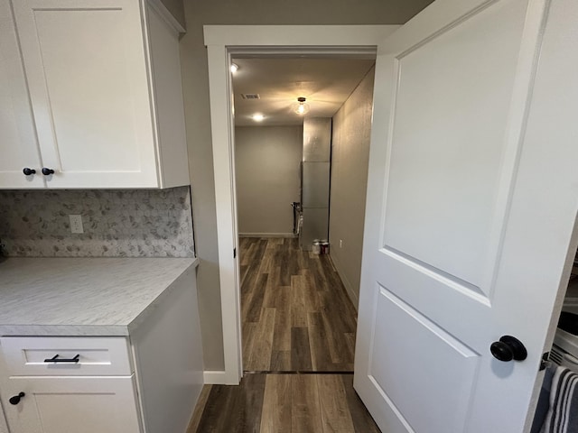 hall featuring dark wood-type flooring