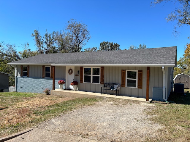 ranch-style home with cooling unit