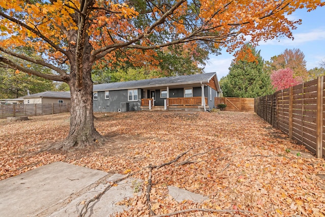 view of front of property featuring a patio and cooling unit