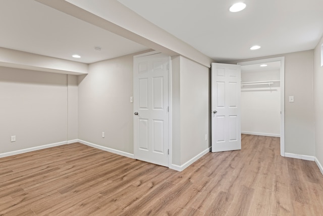 basement featuring light wood-type flooring