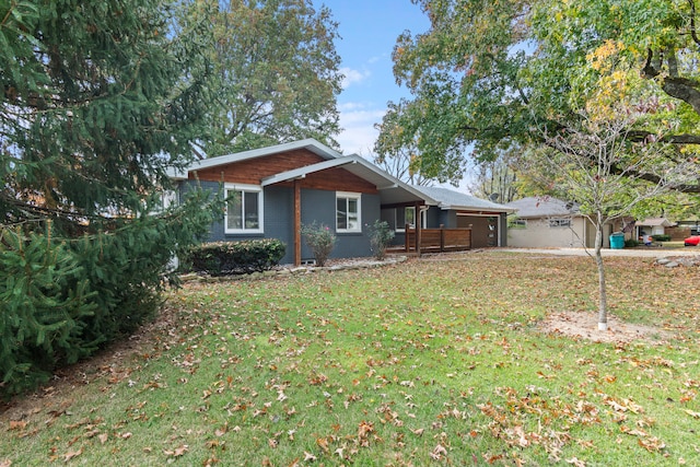 view of side of property with a lawn