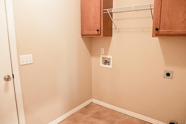 clothes washing area with washer hookup, cabinets, and hookup for an electric dryer