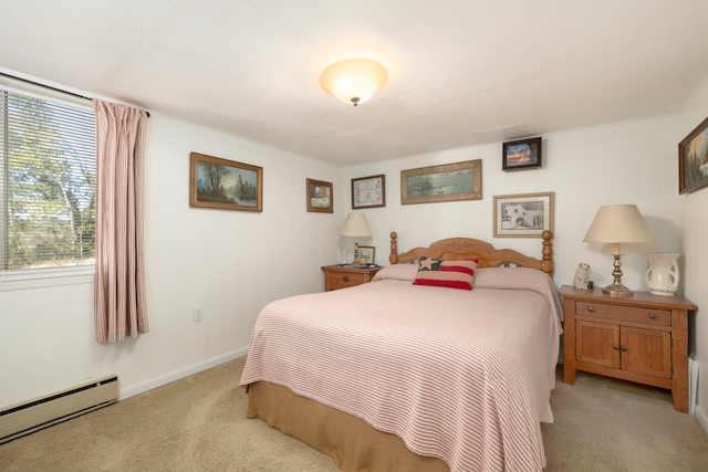 bedroom with light carpet and a baseboard radiator