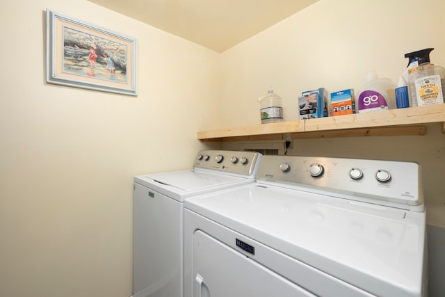 laundry room with washing machine and clothes dryer