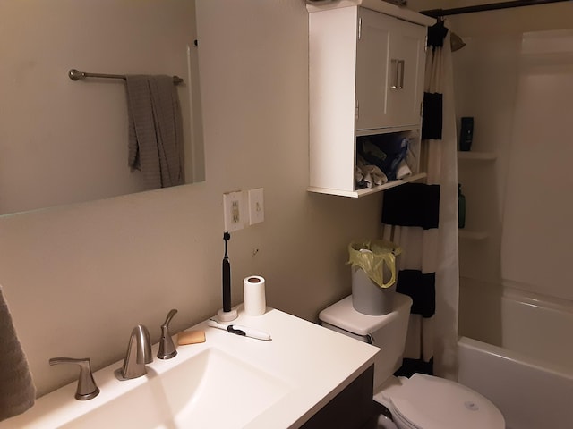 full bathroom featuring shower / bath combination with curtain, toilet, and sink