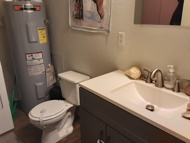 bathroom featuring water heater, a textured wall, wood finished floors, toilet, and vanity