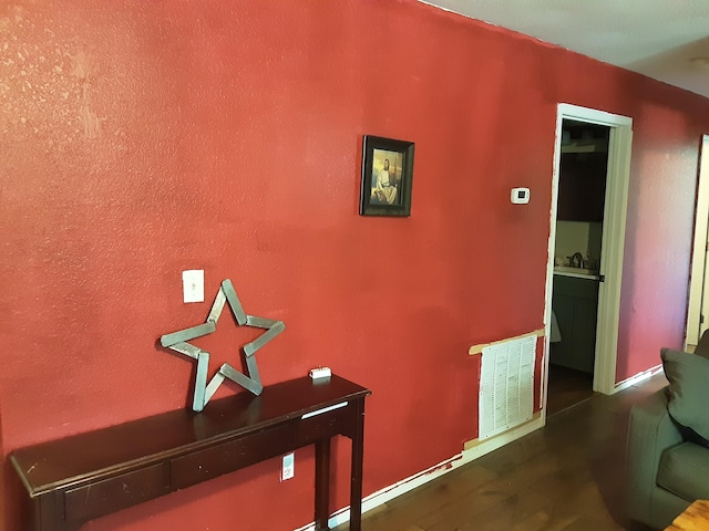 hall featuring dark wood-type flooring