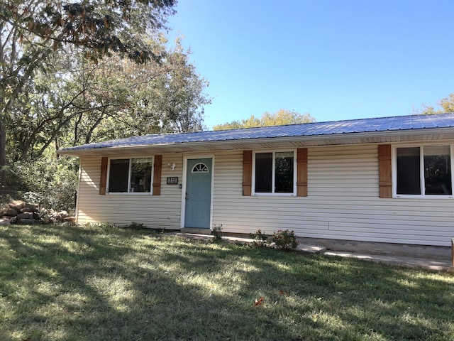 ranch-style home with a front lawn