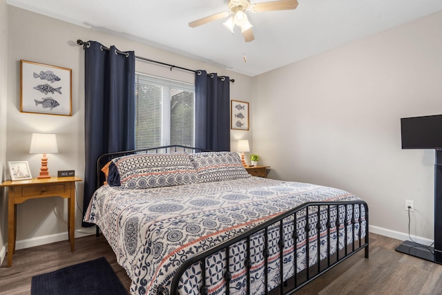 bedroom with ceiling fan and dark hardwood / wood-style floors