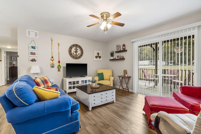 living room featuring hardwood / wood-style flooring and ceiling fan