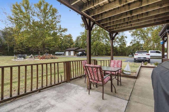 view of patio with an outbuilding