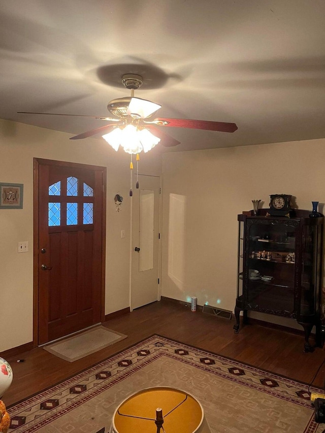 foyer featuring dark hardwood / wood-style floors and ceiling fan