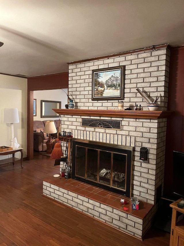 room details with a fireplace and wood-type flooring