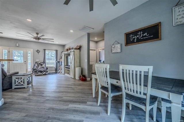 dining room with ceiling fan and wood-type flooring