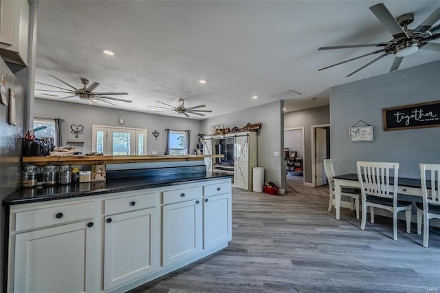 kitchen with white cabinetry and light wood-type flooring