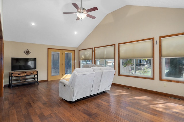 living room featuring dark wood-type flooring, ceiling fan, and high vaulted ceiling