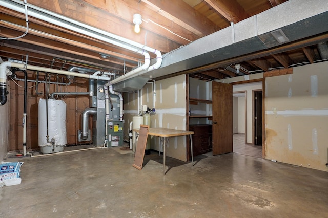 basement with heating unit and gas water heater